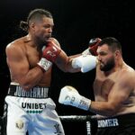 Joe Joyce (izquierda) destruyó a Christian Hammer (derecha) en cuatro asaltos el sábado por la noche