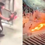 Momento impactante: un fanático pasea por el stand con CHAINSAW mientras los disturbios dejan el estadio en llamas durante el partido de fútbol