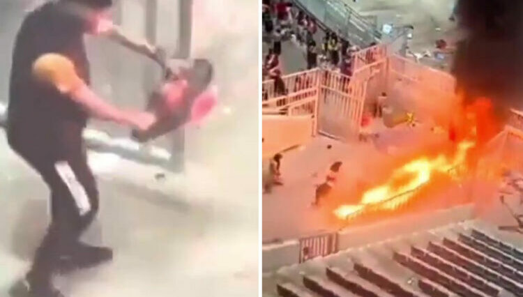 Momento impactante: un fanático pasea por el stand con CHAINSAW mientras los disturbios dejan el estadio en llamas durante el partido de fútbol