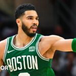 Boston Celtics star Jayson Tatum celebrates hitting a basket