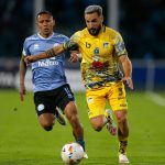 Belgrano's Peruvian forward Bryan Reyna (L) and Delfin's Argentine defender Juan Manuel Elordi fight for the ball during the Copa Sudamericana group stage second leg football match between Argentina's Belgrano and Ecuador's Delfin at the Mario Alberto Kempes stadium in Cordoba, Argentina on May 9, 2024. (Photo by Diego Lima / AFP)