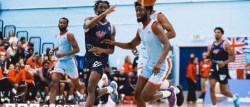 Surrey Scorchers and Bristol Flyers players challenge for the ball during a basketball match