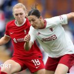 Ceri Holland and Rachel Williams challenge for the ball