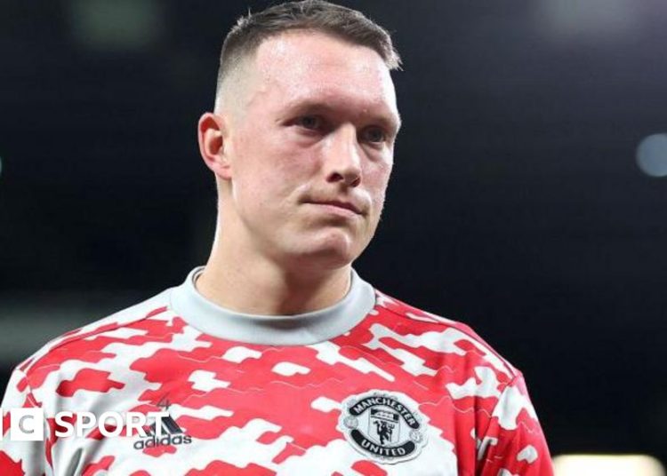 Phil Jones wearing a Manchester United training top