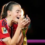 Maria Perez kisses the World Cup