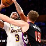 Anthony Davis goes up for a shot against Jakob Poeltl of the Toronto Raptors