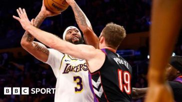 Anthony Davis goes up for a shot against Jakob Poeltl of the Toronto Raptors