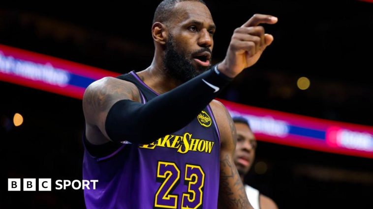 LeBron James and son Bronny on the LA Lakers bench during Sunday's game against the Portland Trail Blazers