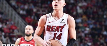 Tyler Herro holding a basketball