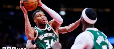 Giannis Antetokounmpo shooting a basket against the Toronto Raptors