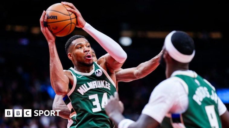 Giannis Antetokounmpo shooting a basket against the Toronto Raptors