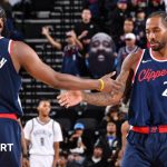 James Harden and Kawhi Leonard celebrate