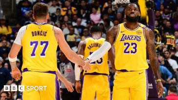 Luka Doncic (left) and LeBron James (right) shake hands on court