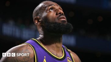 LeBron James looks to the heavens after going off injured during the LA Lakers defeat to Boston Celtics